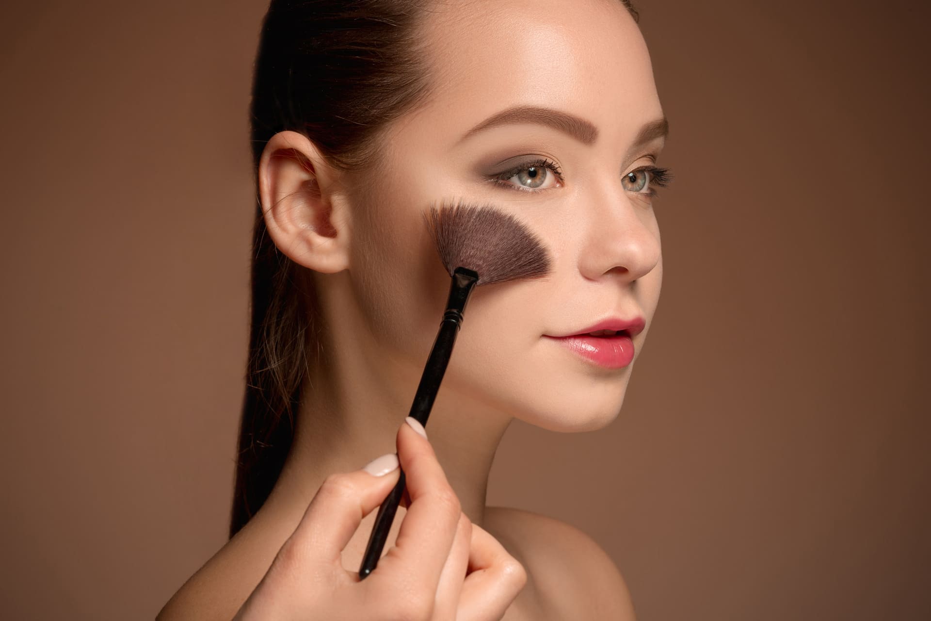 young-woman-putting-makeup.jpg